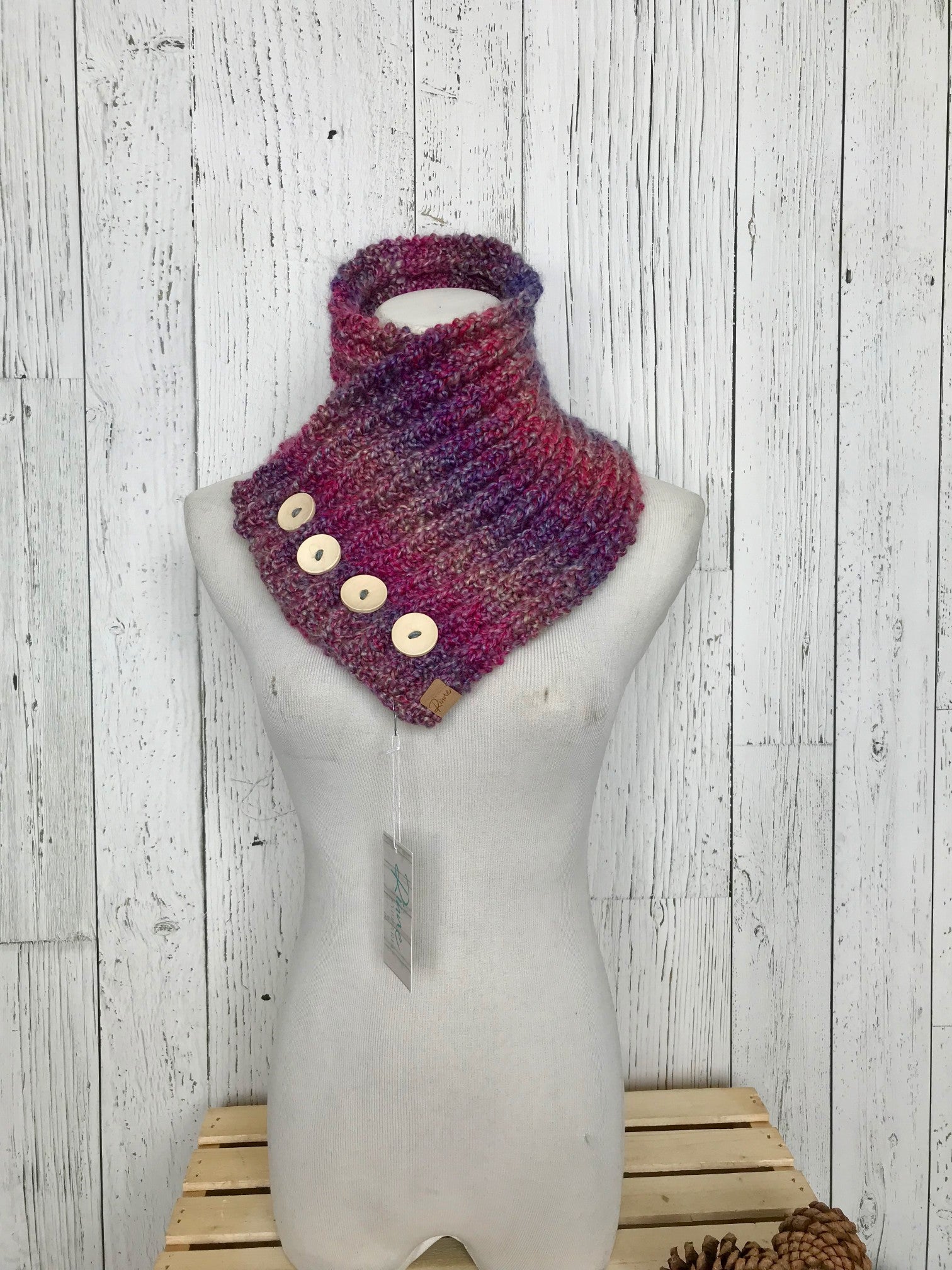 Classic Knit Button Cowl in pink and purple variegated colors with natural wood buttons