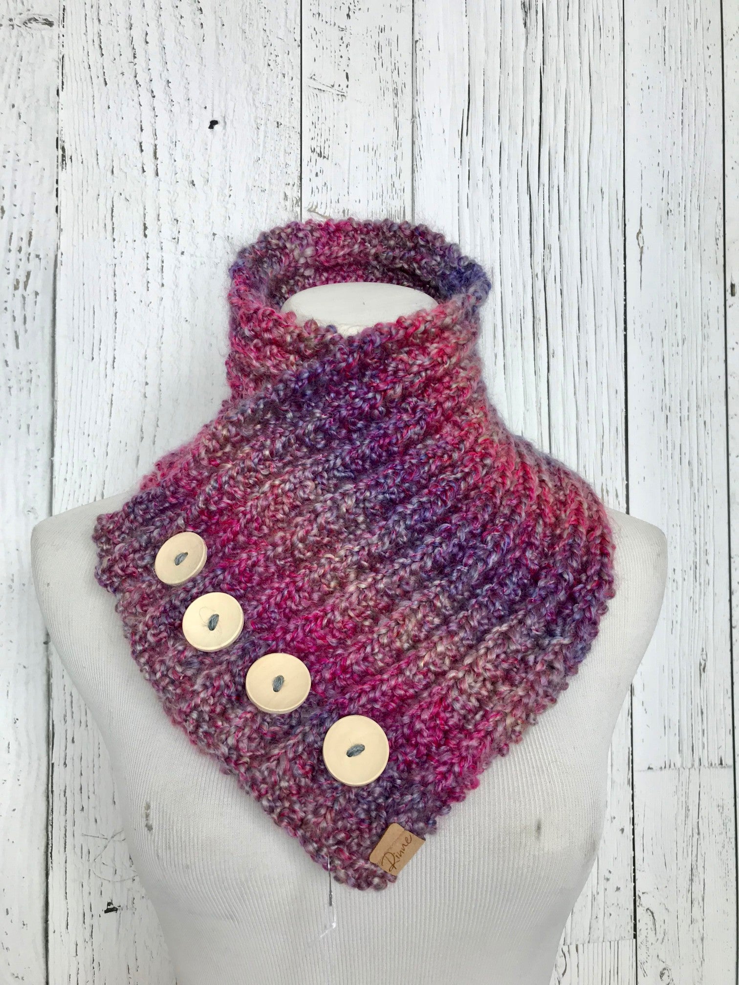 Classic Knit Button Cowl in pink and purple variegated colors with natural wood buttons